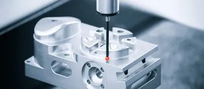 A machine is being made with a red dot